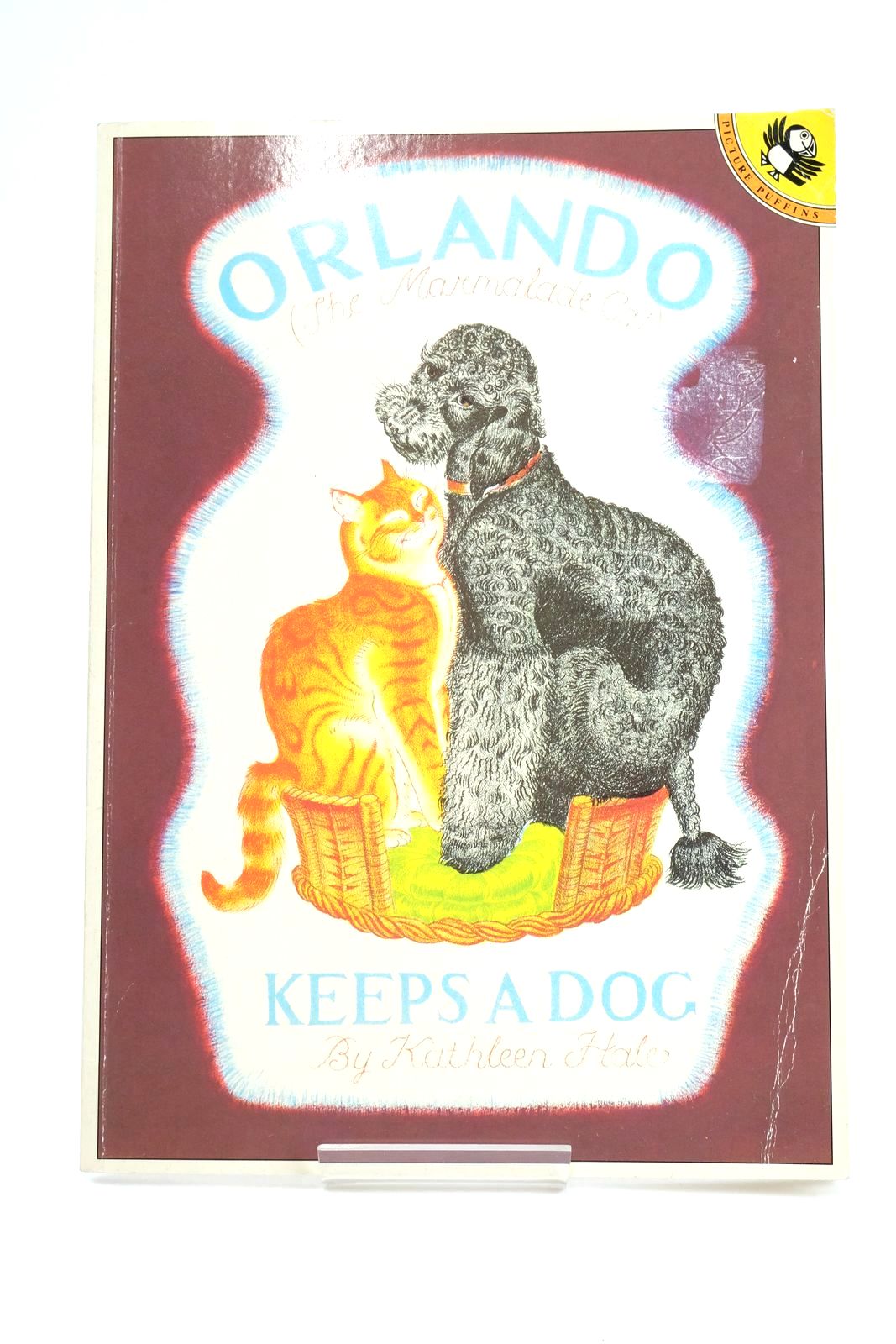 Photo of ORLANDO (THE MARMALADE CAT) KEEPS A DOG- Stock Number: 1323638